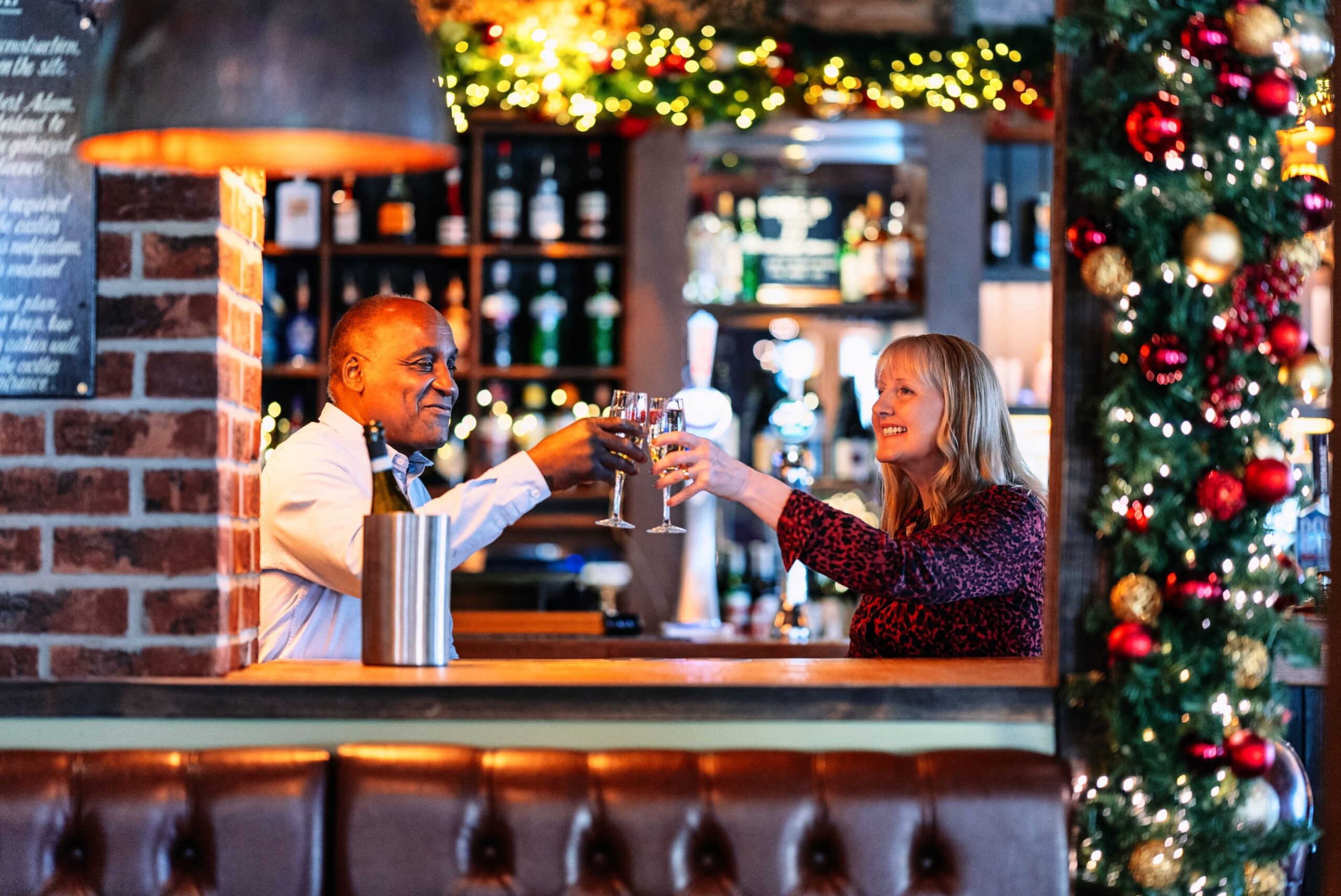 Couple clinking glasses