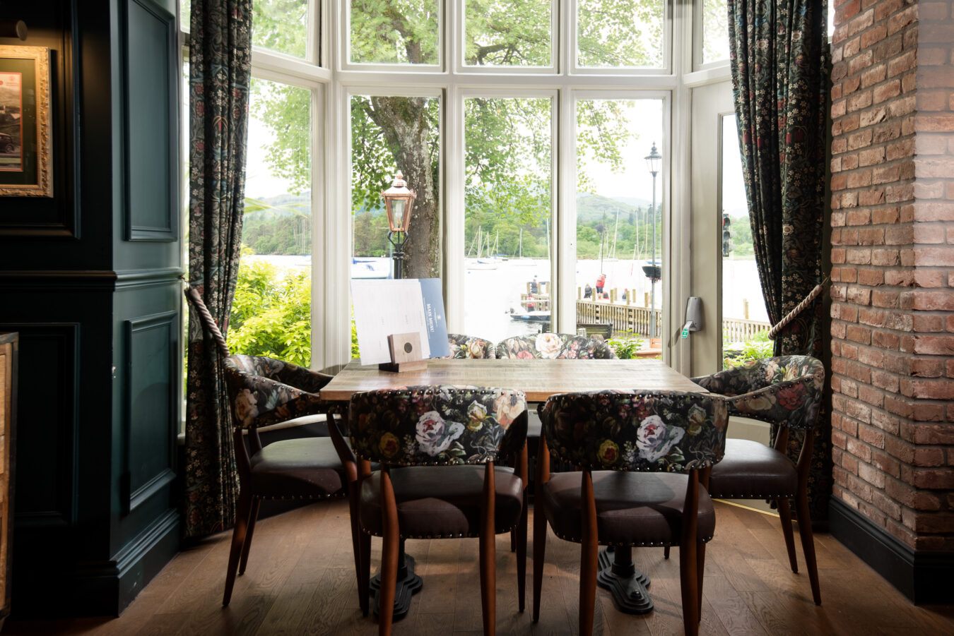 A table and chairs with a view of Windermere