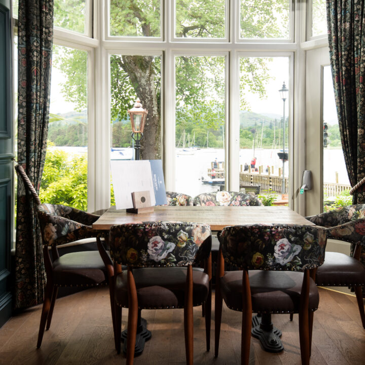 A table and chairs with a view of Windermere